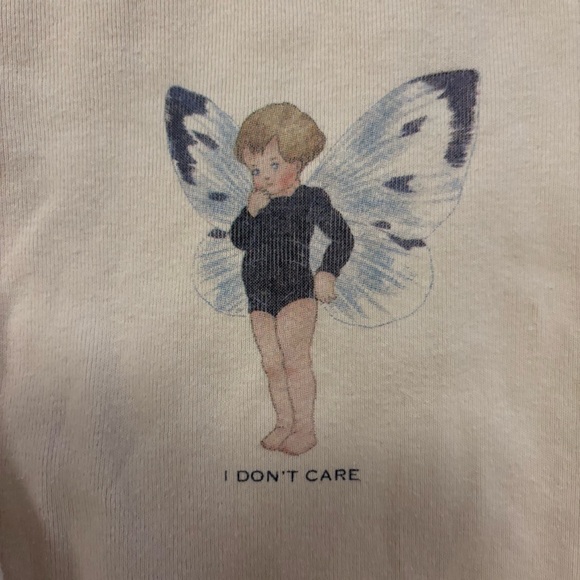 Brandy Melville Off White Creme “I don’t care” fairy graphic baby tee, small - Picture 6 of 7